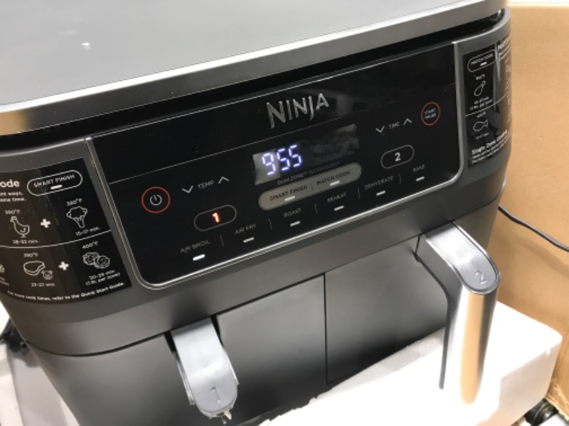Photo 3 of **left handle broken**
Ninja DZ201 Foodi 8 Quart 6-in-1 DualZone 2-Basket Air Fryer with 2 Independent Frying Baskets, Match Cook & Smart Finish to Roast, Broil, Dehydrate & More for Quick, Easy Meals, Grey