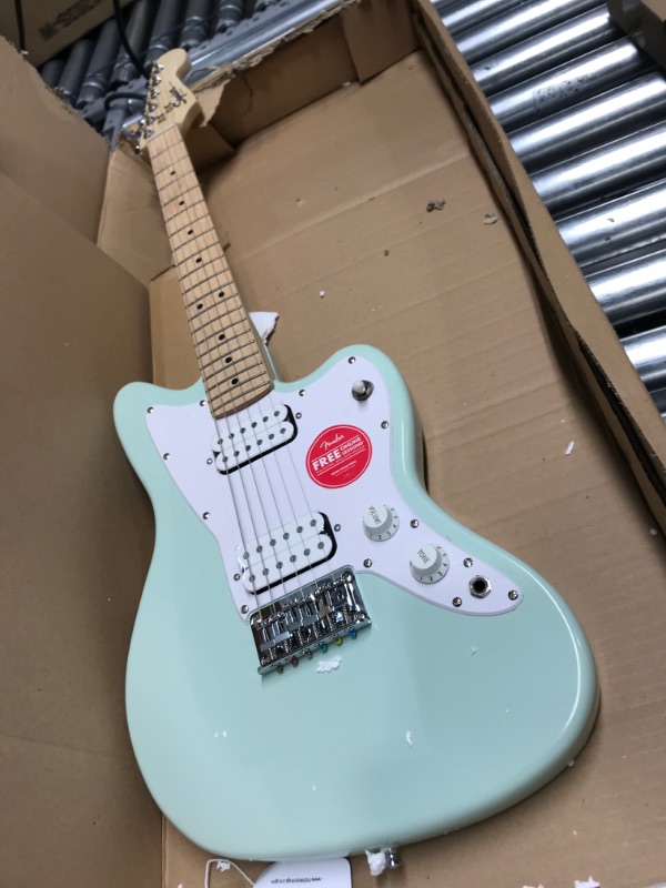 Photo 3 of **PART OF THE GUITAR IS CHIPPED***
Squier by Fender Mini Jazzmaster HH - Maple - Surf Green