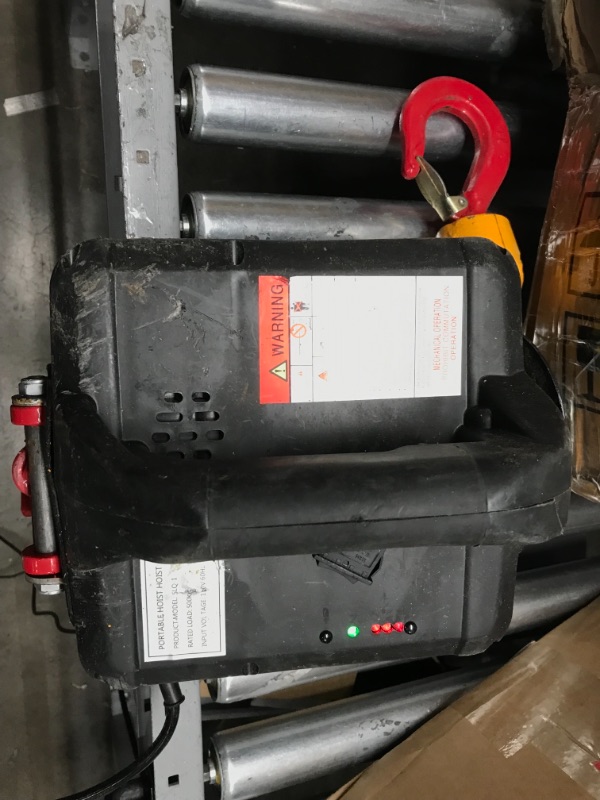 Photo 2 of **SMALL CRACK, BUTTON IS LOOSE BUT FUNCTIONAL, MISSING CONTROLLER**
***
NEWTRY 3 in 1 Electric Hoist Winch 1,100lb Wireless Remote Control, Cable Remote Control, 110/120 Volt Portable Power Electric Hoist, Vertically & Horizontally, Lift 16ft/min 1100lb, 