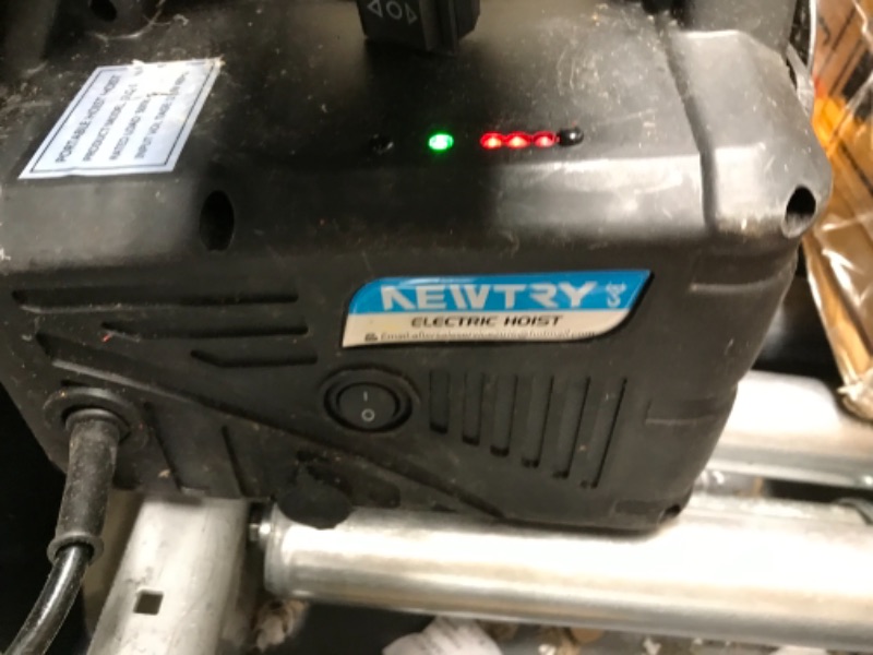 Photo 3 of **SMALL CRACK, BUTTON IS LOOSE BUT FUNCTIONAL, MISSING CONTROLLER**
***
NEWTRY 3 in 1 Electric Hoist Winch 1,100lb Wireless Remote Control, Cable Remote Control, 110/120 Volt Portable Power Electric Hoist, Vertically & Horizontally, Lift 16ft/min 1100lb, 