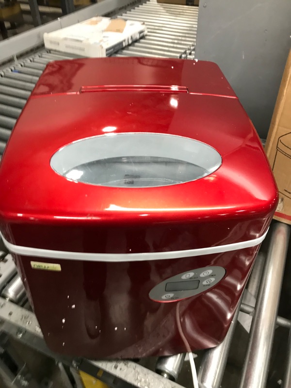 Photo 2 of NewAir Portable Ice Maker 50 lb. Daily | Red | 3 Size Bullet Shaped Ice | First Batch Under 10 Minutes | Self Cleaning Quiet Operation Countertop Ice Machine | AI-215R 
MINOR DAMAGE
