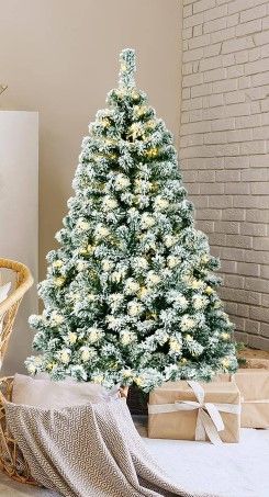 Photo 1 of 4.5 ft. Pre-Lit Snow Flocked Artificial Christmas Tree Hinged Pine Tree Holiday Decoration = UL Multicolor lights 
