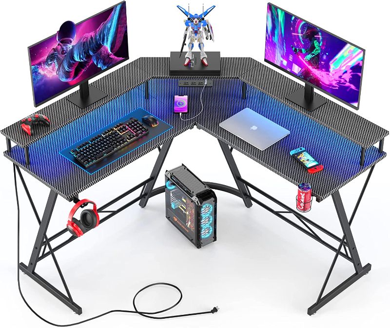 Photo 1 of *Loose Hardware-Possibly Missing/Minor Damage-See Photos* Mr IRONSTONE Gaming Desk with Led Lights ?Power Outlet, L Shaped Computer Corner Desk with Cup Holder ? Headphone Hook, Carbon Fiber Home Office Desks with Large Monitor Stand, Graphite Black, 50''