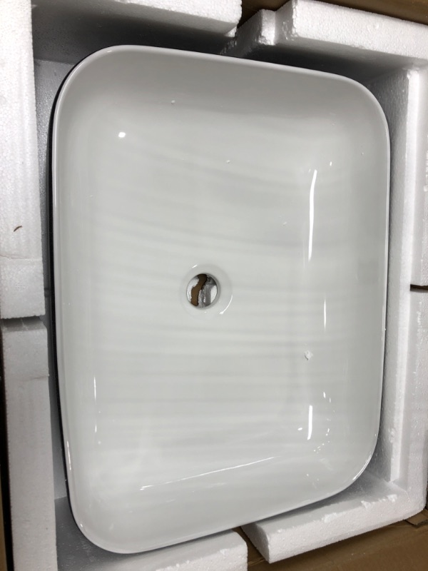 Photo 1 of Black and White Ceramic Bathroom Sink, 19" x 15" Above Counter Porcelain Vessel Sink with Black Faucet and Pop up drain Combo, Rectangle