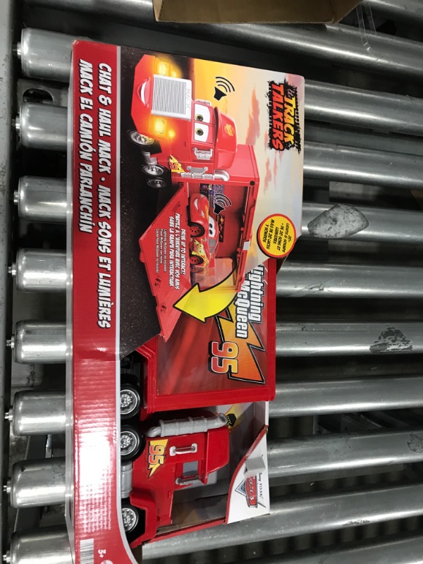 Photo 2 of Disney Car Toys Track Talkers Toy Truck, Chat & Haul Mack Hauler with Lights & Sound, Stores 2 Cars, 17 Inch Simplified Packaging