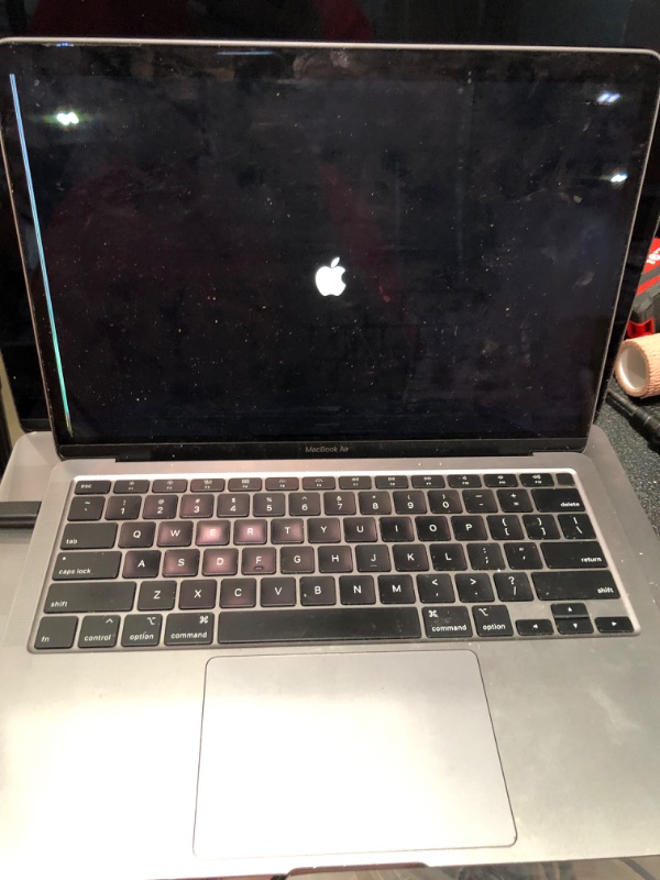 Photo 1 of **PARTS ONLY**APPLE MACBOOK AIR MODEL A2179, DAMAGED SCREEN, POWERS ON BUT STAYS ON SCREEN WITH APPLE LOGO, LAPTOP ONLY NO CHARGER 