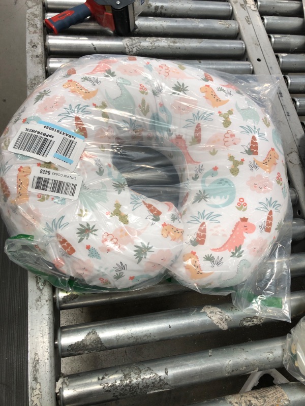 Photo 1 of Boppy Nursing Pillow Original Support, Pink Blush Baby Dinosaurs, Ergonomic Nursing Essentials for Bottle and Breastfeeding, Firm Fiber Fill, with Removable Nursing Pillow Cover, Machine Washable
