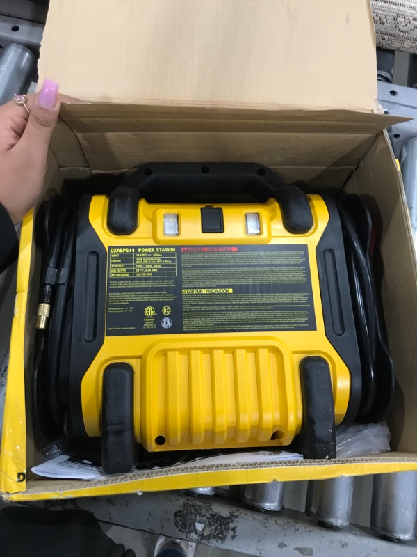 Photo 2 of DEWALT DXAEPS14 1600 Peak Battery Amp 12V Automotive Jump Starter/Power Station with 500 Watt AC Power Inverter, 120 PSI Digital Compressor, and USB Power , Yellow