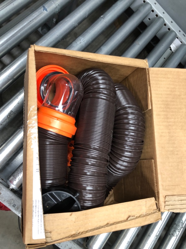 Photo 2 of Camco RhinoFLEX RV Sewer Hose Kit with Swivel Transparent Elbow and 4-in-1 Dump Station Fitting, Brown, 15 Feet (39770) 15ft Sewer Hose Kit Frustration-Free Packaging