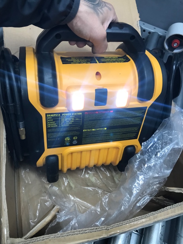 Photo 2 of DEWALT DXAEPS14 1600 Peak Battery Amp 12V Automotive Jump Starter/Power Station with 500 Watt AC Power Inverter, 120 PSI Digital Compressor, and USB Power , Yellow