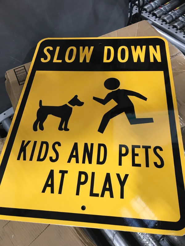 Photo 1 of "Slow Down - Kids And Pets At Play" Sign By SmartSign | 18" x 24" 3M High Intensity Grade Reflective Aluminum