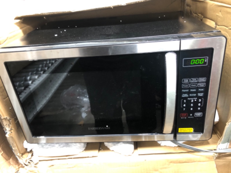 Photo 2 of *MINOR DAMAGE* Farberware Countertop Microwave 1.1 Cu. Ft. 1000-Watt Compact Microwave Oven with LED lighting, Child lock, and Easy Clean Interior, Stainless Steel Interior & Exterior Stainless Steel Microwave Oven