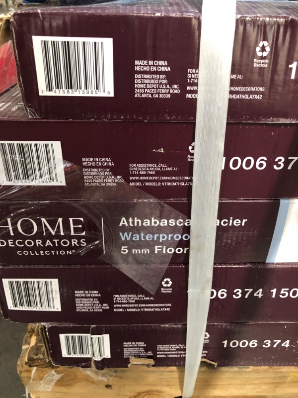 Photo 3 of **SET OF 10 CASES** ROUGHLY 200 SQ FT** SEE NOTES* Garrett Oak 9.5 in. W x 50.6 in. L Waterproof Hybrid Resilient Flooring (26.7 sq. ft./case)
