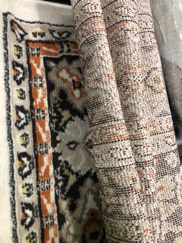 Photo 1 of 6ft brow, cream and orange area rug  