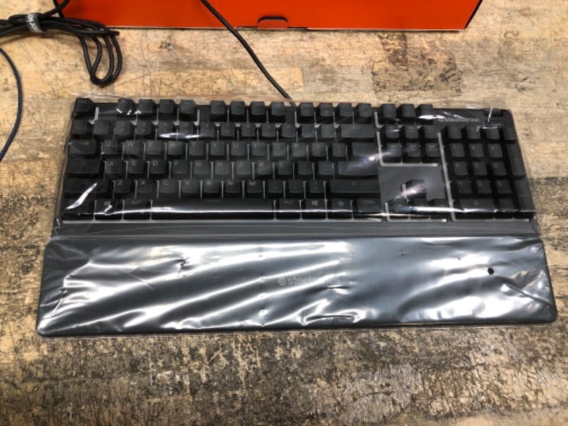 Photo 2 of SteelSeries Apex 3 RGB Gaming Keyboard – 10-Zone RGB Illumination – IP32 Water Resistant – Premium Magnetic Wrist Rest (Whisper Quiet Gaming Switch)