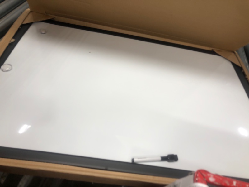 Photo 2 of Amazon Basics Magnetic Dry Erase White Board, 35 x 23-Inch Whiteboard - Black Wooden Frame 23"x35" Magnetic, Wood Frame