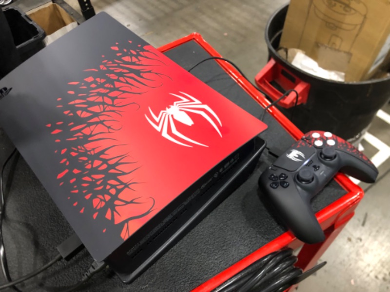 Photo 1 of SCRATCHED; PlayStation 5 Console THIS IS NOT THE AMAZON LISTED BUNDLE; THEREFORE, THE PACKAGE DOES NOT INCLUDE "VAUCHER FOR A DIGITAL COPY OF THE STANDARD EDITION OF THE GAME." PACKAGE ONLY INCLUDES CONSOLE, REMOTE, BASE, AND POWER CORDS. 