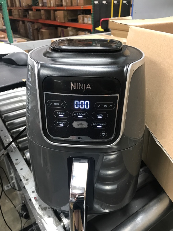 Photo 2 of (USED AND FOR PARTS OONLY) Ninja AF150AMZ Air Fryer XL, 5.5 Qt. Capacity that can Air Fry, Air Roast, Bake, Reheat & Dehydrate, with Dishwasher Safe, Nonstick Basket & Crisper Plate and a Chef-Inspired Recipe Guide, Grey