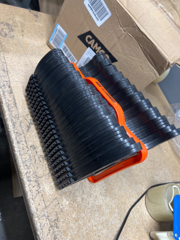 Photo 1 of Camco Sidewinder RV Sewer Support | Made from Sturdy Lightweight Plastic | Curve Around Obstacles and Won't Creep Closed | 20 Feet | Black | (43052) Frustration Free Packaging