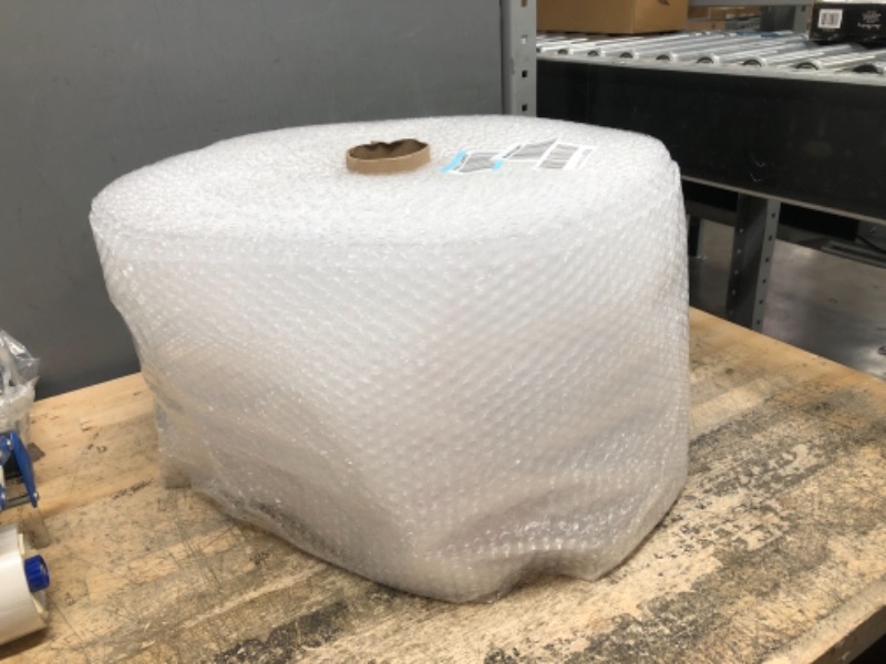 Photo 2 of Amazon Basics Perforated Bubble Cushioning Wrap, Small 3/16", 12-Inch x 175 Foot Long Roll, Clear
