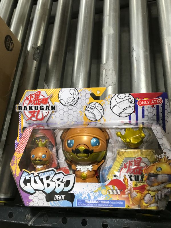 Photo 2 of Bakugan 2021 Gold King Cubbo Deka Pack Jumbo Collectible Transforming Figure with King Cubbo 2-inch Core Figure and Trading Cards
