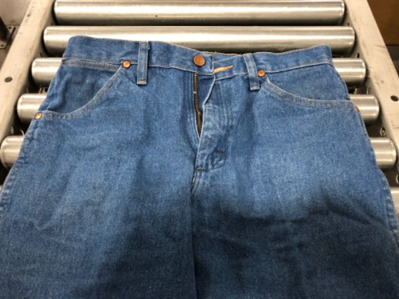 Photo 4 of MEN'S WRANGLER BLUE JEANS. SIZE 31 X 30 INCH. SOME STAINS FROM PRIOR USE.
