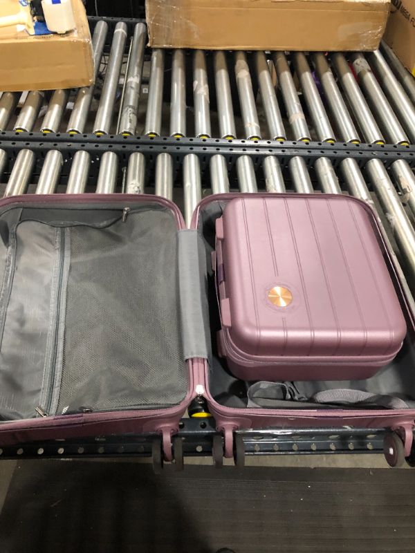 Photo 2 of 2 piece purple luggage unknown brand 

comes with 20" x 15" & 13" x 11"