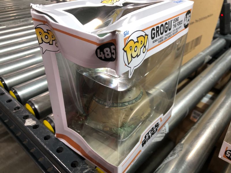 Photo 1 of Funko POP! Deluxe: The Mandalorian - Grogu seated on a Seeing Stone,  STAR WARS™ The Mandalorian™ with Pop! Deluxe Grogu  This special figure also emits sounds and lights up. Vinyl bobblehead is approximately 4.75-inches tall. 