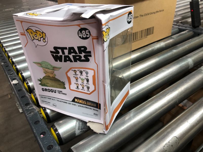 Photo 2 of Funko POP! Deluxe: The Mandalorian - Grogu seated on a Seeing Stone,  STAR WARS™ The Mandalorian™ with Pop! Deluxe Grogu  This special figure also emits sounds and lights up. Vinyl bobblehead is approximately 4.75-inches tall.