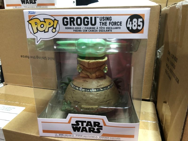 Photo 3 of .Funko POP! Deluxe: The Mandalorian - Grogu seated on a Seeing Stone,  STAR WARS™ The Mandalorian™ with Pop! Deluxe Grogu  This special figure also emits sounds and lights up. Vinyl bobblehead is approximately 4.75-inches tall.