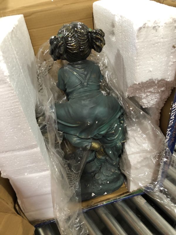 Photo 1 of Alpine Girl Jumping Over Boy Garden Statue
