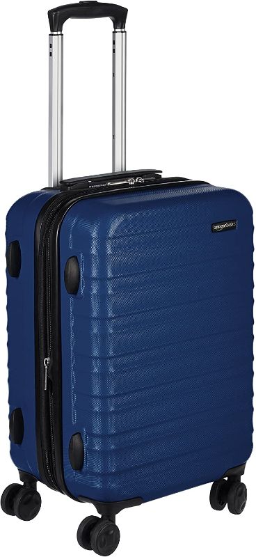 Photo 1 of AmazonBasics Hardside Carry On Spinner Travel Luggage Suitcase - 20 Inch, Navy Blue
