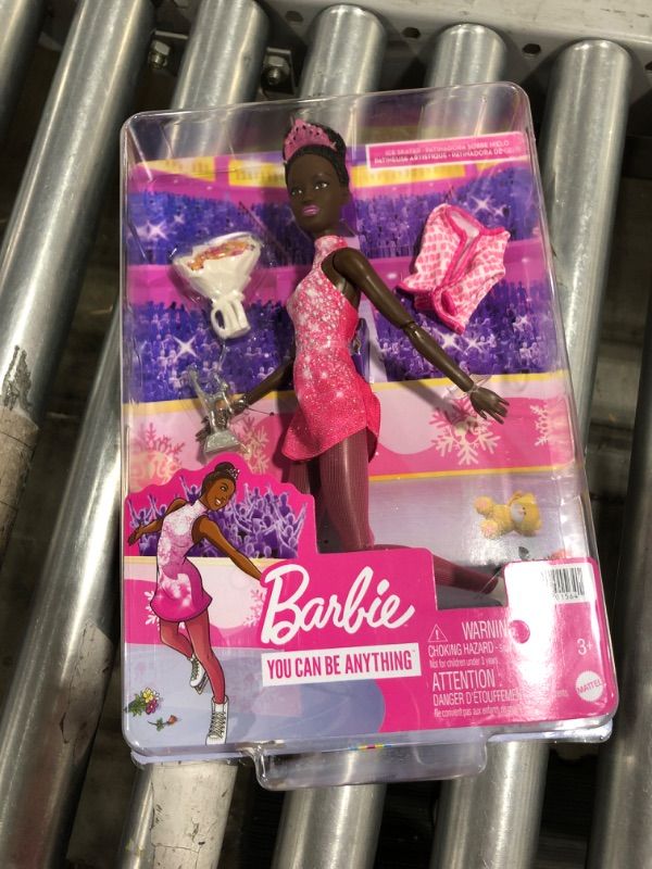 Photo 2 of Barbie Winter Sports Ice Skater Brunette Doll (12 Inches) with Pink Dress, Jacket, Rose Bouquet & Trophy, Great Gift for Ages 3 and Up
