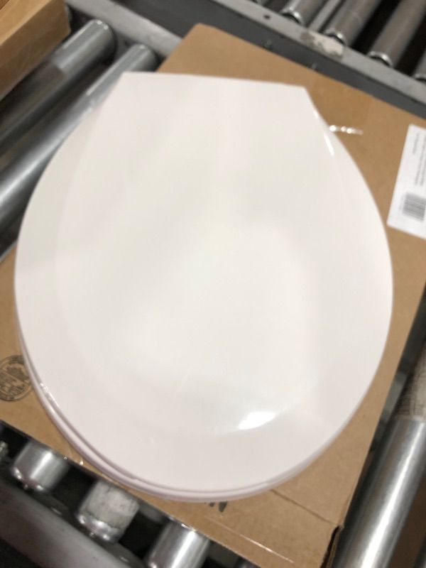 Photo 2 of Centoco Round Plastic Toilet Seat, White
