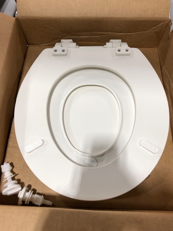 Photo 5 of Ginsey Home Solutions Ginsey Adult & Child Wood Plastic Potty Ring & EZ-Off Hinges Round Toilet Seat, Other. CHIPPED PAINT. OPEN PACKAGE.
