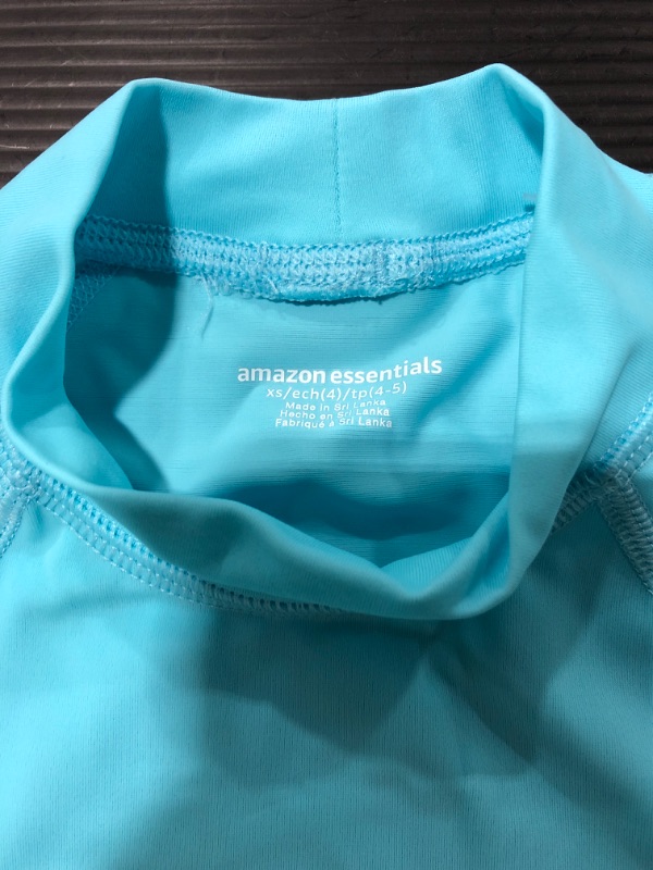 Photo 2 of Amazon Essentials Girls and Toddlers' UPF 50+ Long-Sleeve Rashguard. SIZE XS. AQUA. 
