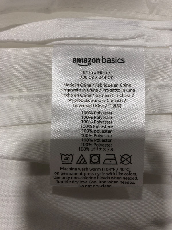 Photo 3 of AMAZON BASICS SHEET SET, WHITE. SIZE 81 X 96 INCHES. MISSING PACKAGE. 1 STANDARD SHEET, 1 FITTED SHEET, 2 PILLOWCASES.