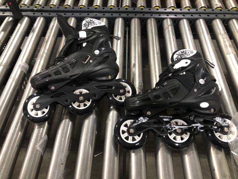 Photo 1 of Black and White RollerBlades (fits like a mens 9)