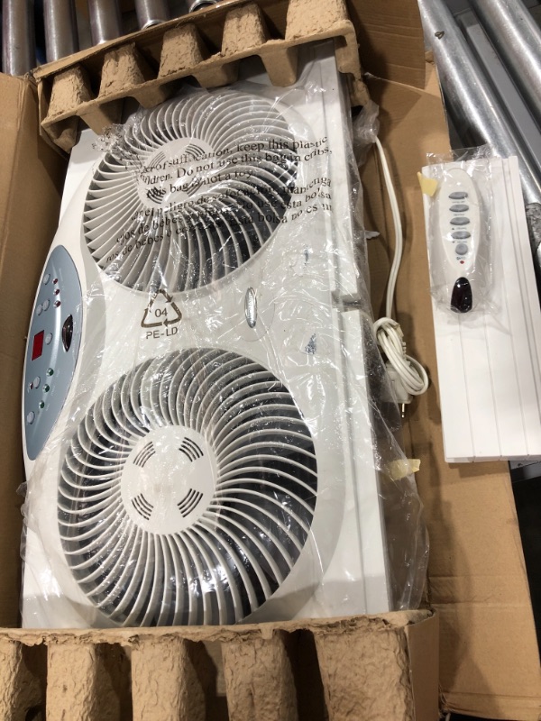 Photo 2 of Bionaire Window Fan with Twin 8.5-Inch Reversible Airflow Blades and Remote Control, White
