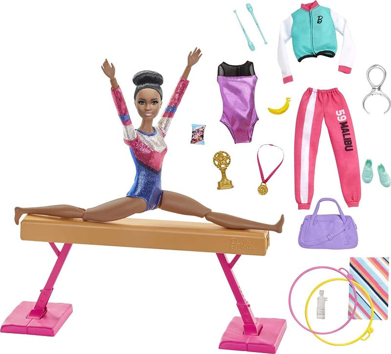 Photo 1 of Barbie Gymnastics Playset: Brunette Doll with Twirling Feature, Balance Beam, 15+ Accessories, Great Gift for Ages 3 to 7 Years Old
