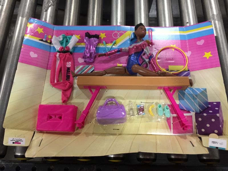 Photo 2 of Barbie Gymnastics Playset: Brunette Doll with Twirling Feature, Balance Beam, 15+ Accessories, Great Gift for Ages 3 to 7 Years Old
