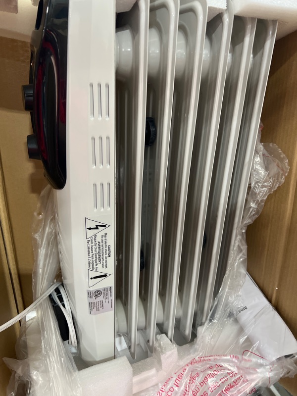 Photo 3 of Amazon Basics Indoor Portable Radiator Heater - White
