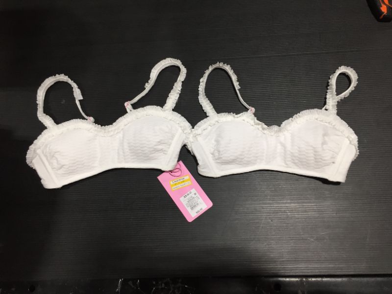 Photo 1 of a pair of XS Girl bikini tops. white