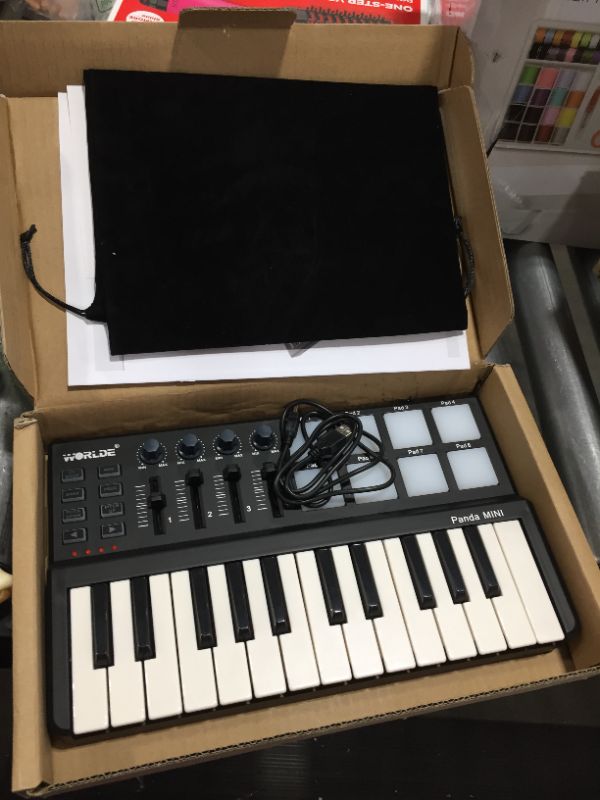 Photo 2 of Worlde Panda Portable MIDI Keyboard Controller Mini 25-Key USB Keyboard 8 Drum Pads 8 Control Buttons
