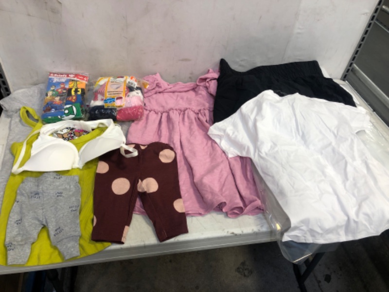 Photo 1 of BAG LOT, ASSORTED KIDS' AND ADULT CLOTHING BUNDLE, VARIOUS SIZES AND COLORS, CLOTHING SOLD AS IS