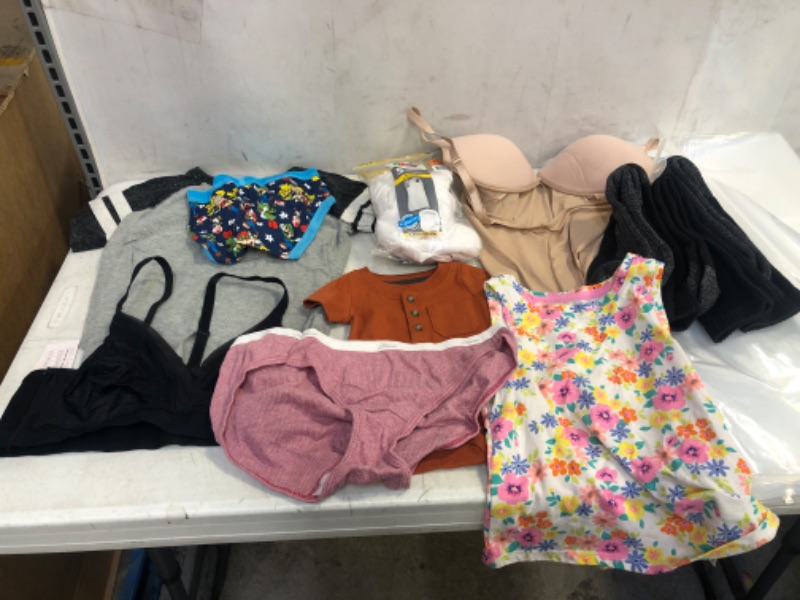 Photo 1 of BAG LOT, ASSORTED KIDS' AND ADULT CLOTHING BUNDLE, VARIOUS SIZES AND COLORS, CLOTHING SOLD AS IS