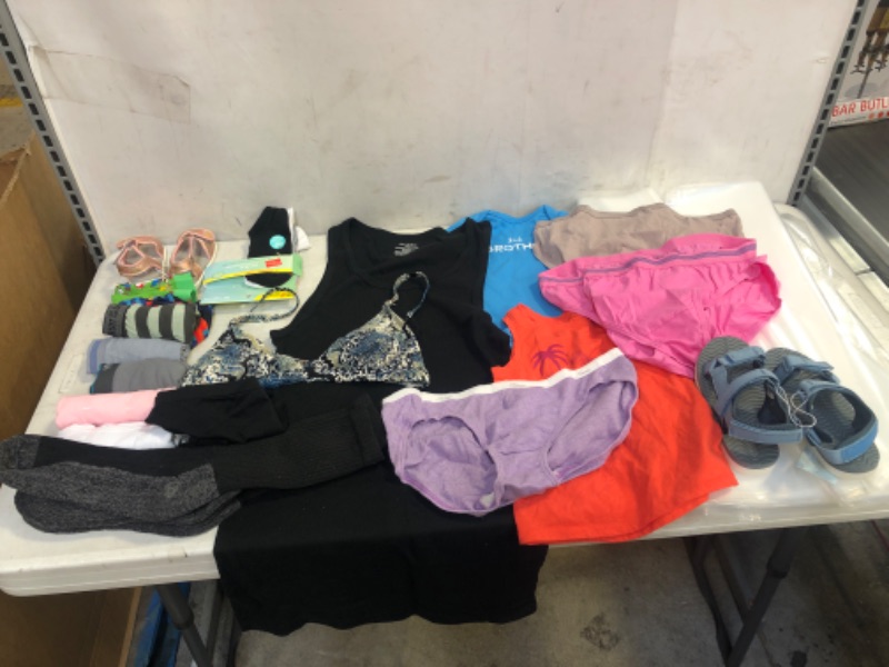 Photo 1 of BAG LOT, ASSORTED KIDS' AND ADULT CLOTHING BUNDLE, VARIOUS SIZES AND COLORS, CLOTHING SOLD AS IS