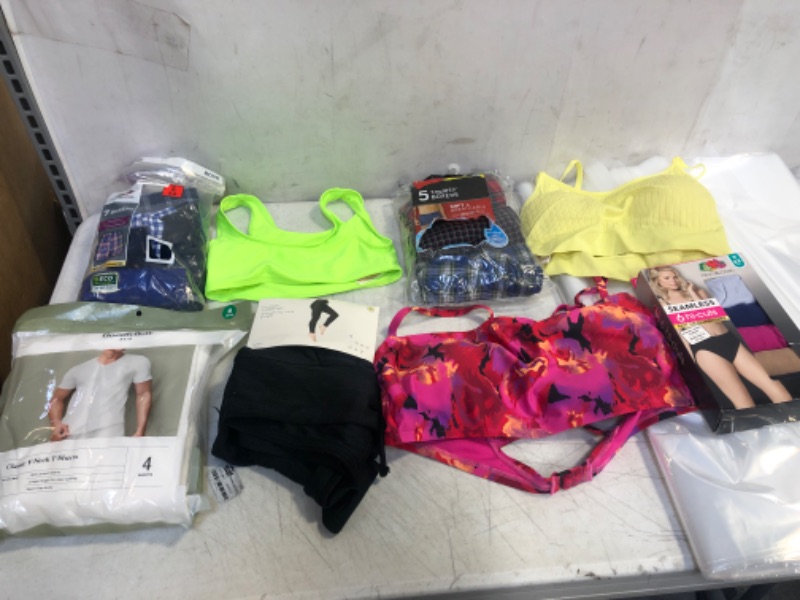 Photo 1 of BAG LOT, ASSORTED KIDS' AND ADULT CLOTHING BUNDLE, VARIOUS SIZES AND COLORS, CLOTHING SOLD AS IS