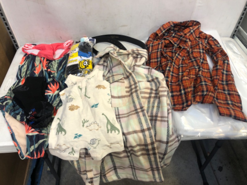 Photo 1 of BAG LOT, ASSORTED KIDS' AND ADULT CLOTHING BUNDLE, VARIOUS SIZES AND COLORS, CLOTHING SOLD AS IS