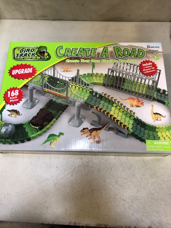 Photo 2 of Batlofty Dinosaur Toys Race Track, Flexible Track Playset, Create A Dinosaur World Road Race with 1 Dinosaur Car and 6 Dinosaur Toys for 3 4 5 6 7 Year Old Boys Girls Birthday Gifts  -- FACTORY SEALED --
